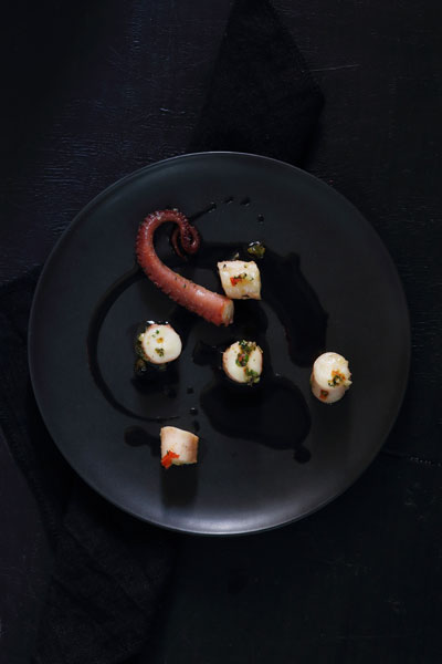 sophisticated halloween party food Octopus with Squid in beurre noir