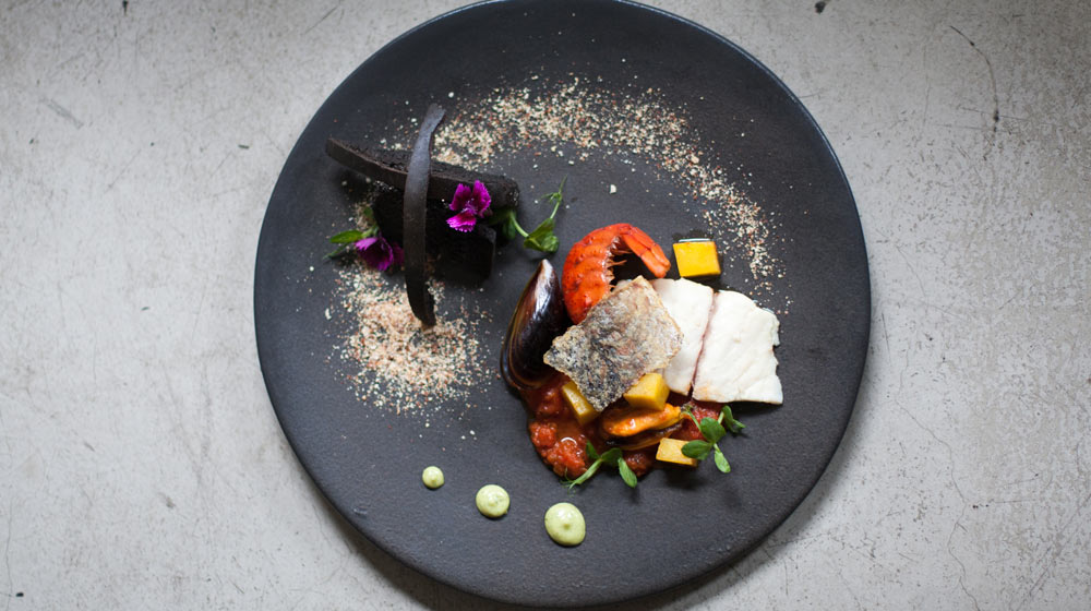seafood poitjie with squid ink toast