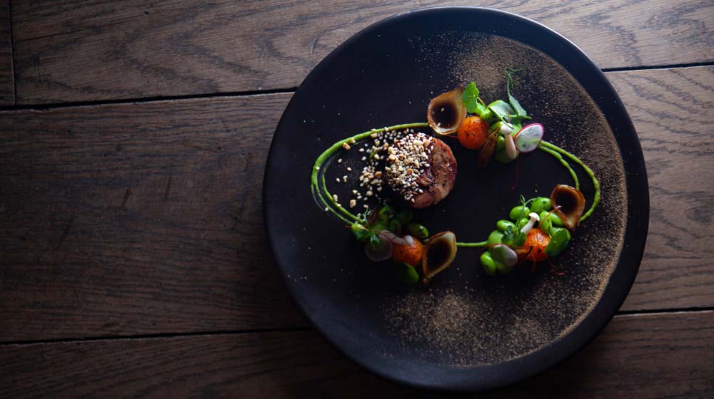 Le chêne restaurant 18hour confit Karoo lamb neck, mountain nettle and river cress purée, edamame beans, Brussels sprout and peral onion cups, brûlée butternut spheres, lamb jus gras