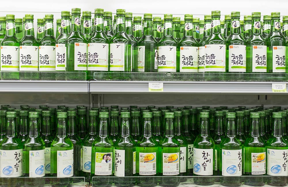 What is Soju? article, featuring soju brands in Korean grocery store. 
